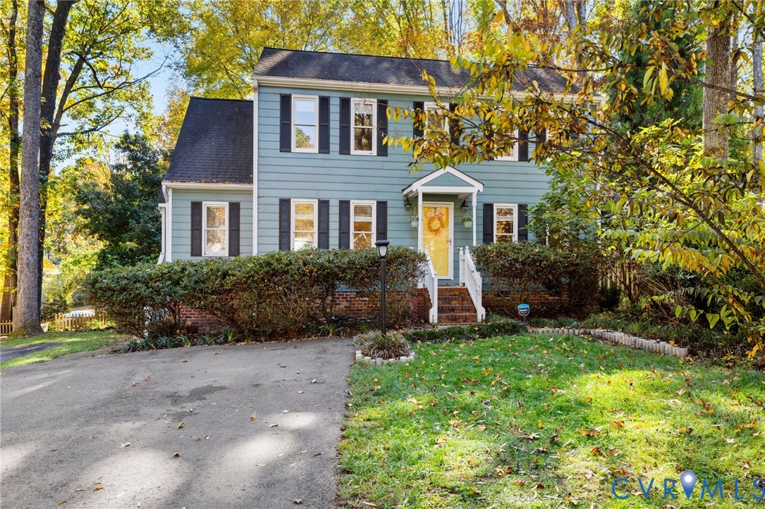 14701 Acorn Ridge Place Midlothian, VA 23112 - Photo 2 of 26 a front view of a house with a yard