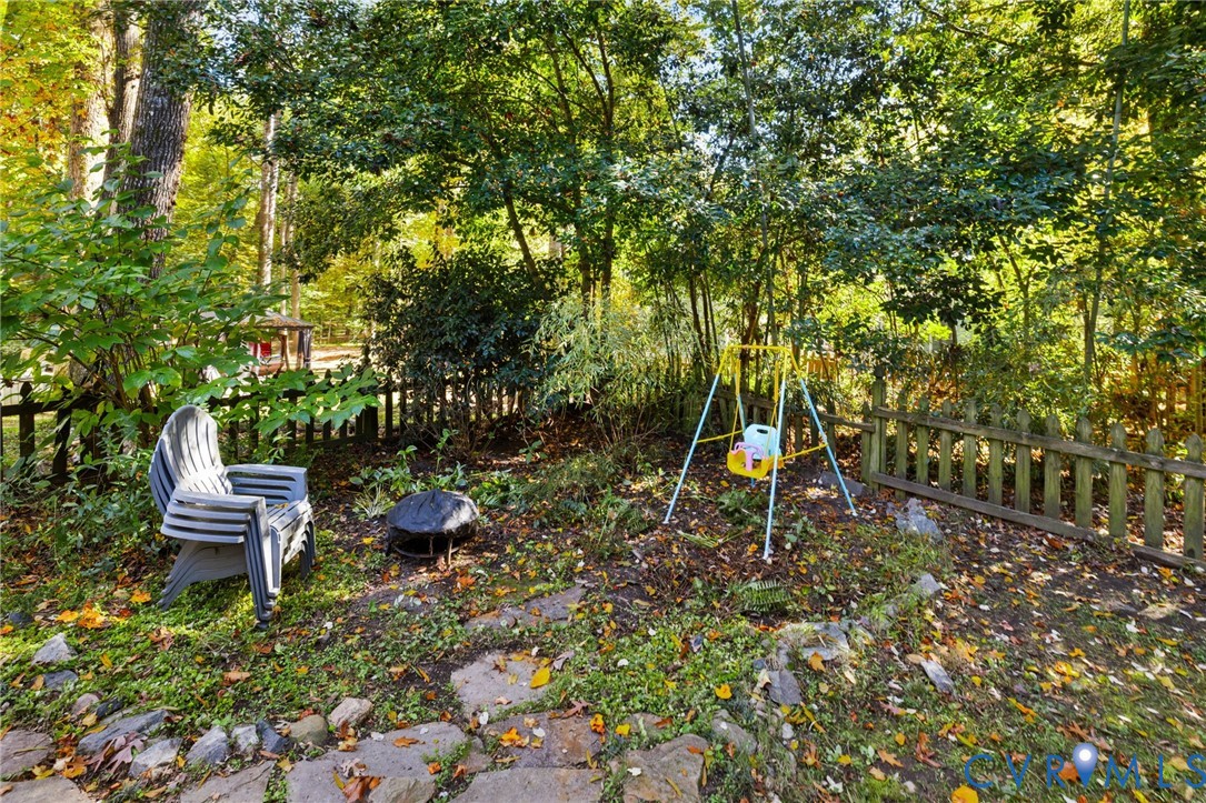 14701 Acorn Ridge Place Midlothian, VA 23112 - Photo 23 of 26 a backyard of a house with table and chairs