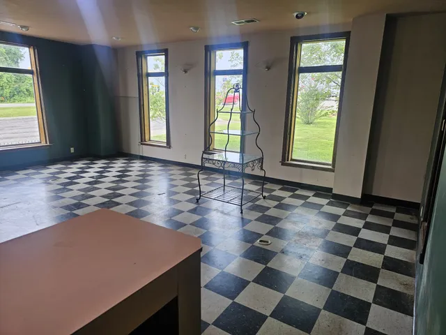 a view of storage and utility room with window
