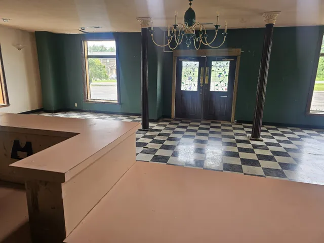 a bathroom with a shower and a sink