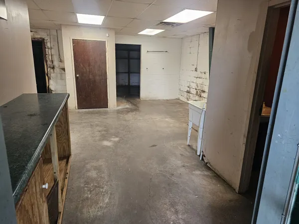 a bathroom with a toilet and a mirror