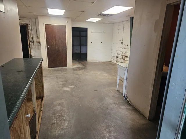 a bathroom with a toilet and a mirror