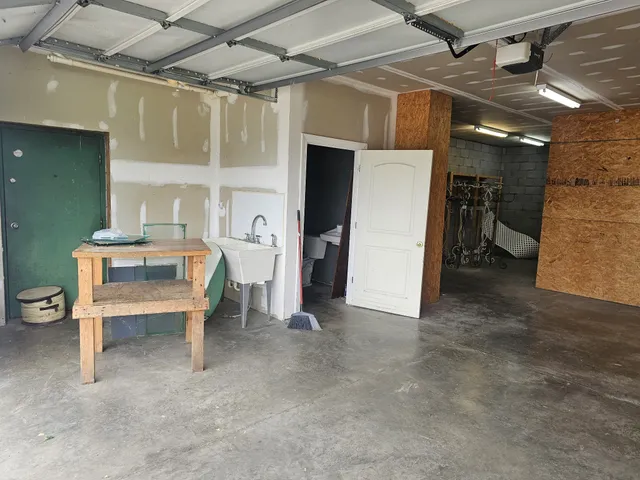 a kitchen with stainless steel appliances a sink stove and cabinets