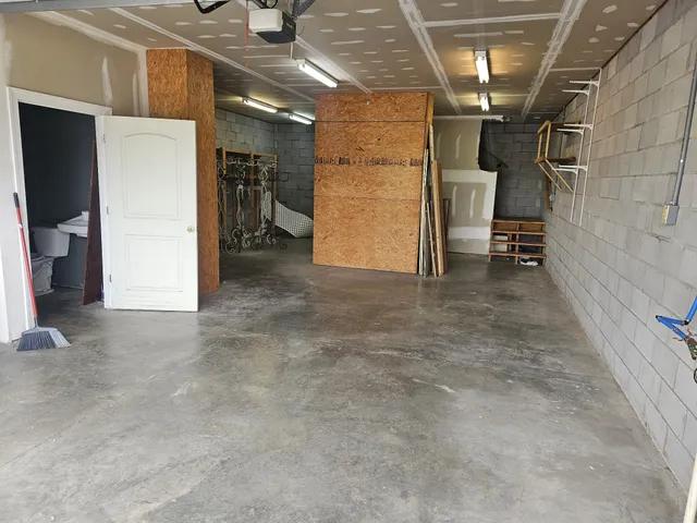 a kitchen with stainless steel appliances granite countertop a refrigerator and a stove
