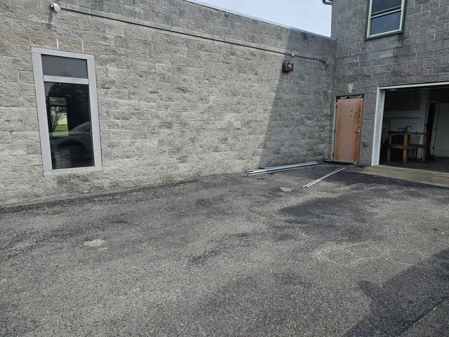 a view of an empty room with a fireplace