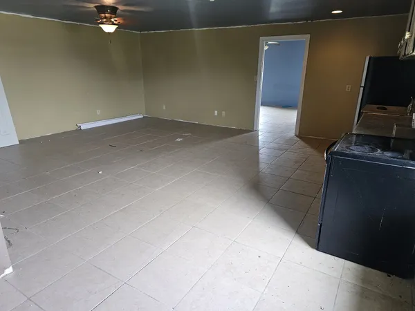 a bathroom with a granite countertop sink a toilet and mirror