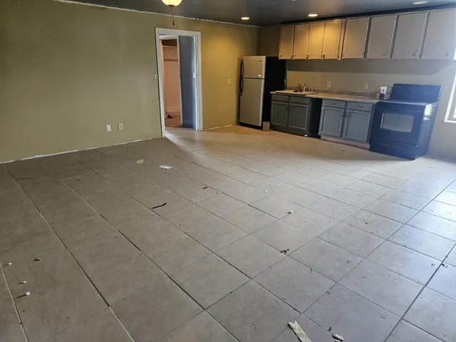 front view of a brick house with a yard