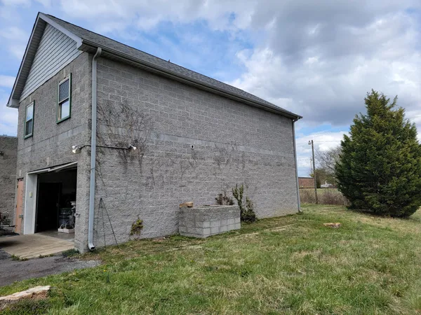a brick building with a yard