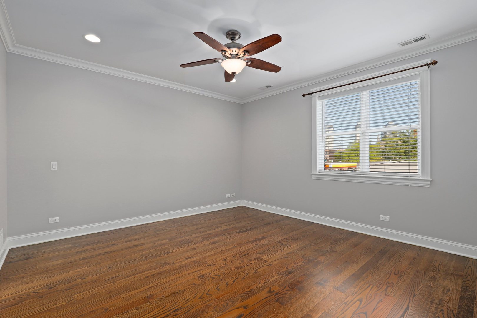 3549 North Reta Avenue, Unit 2 Chicago, IL 60657 - Photo 17 of 30 an empty room with wooden floor and windows