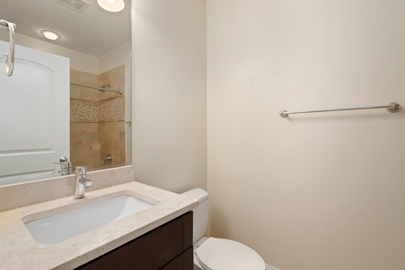 3549 North Reta Avenue, Unit 2 Chicago, IL 60657 - Photo 26 of 30 a bathroom with a sink toilet and a mirror