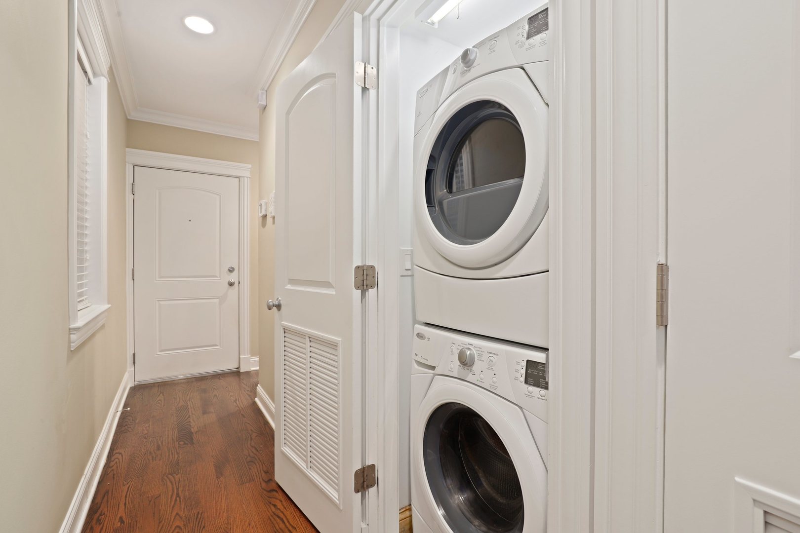 3549 North Reta Avenue, Unit 2 Chicago, IL 60657 - Photo 27 of 30 a view of a hallway with washer and dryer