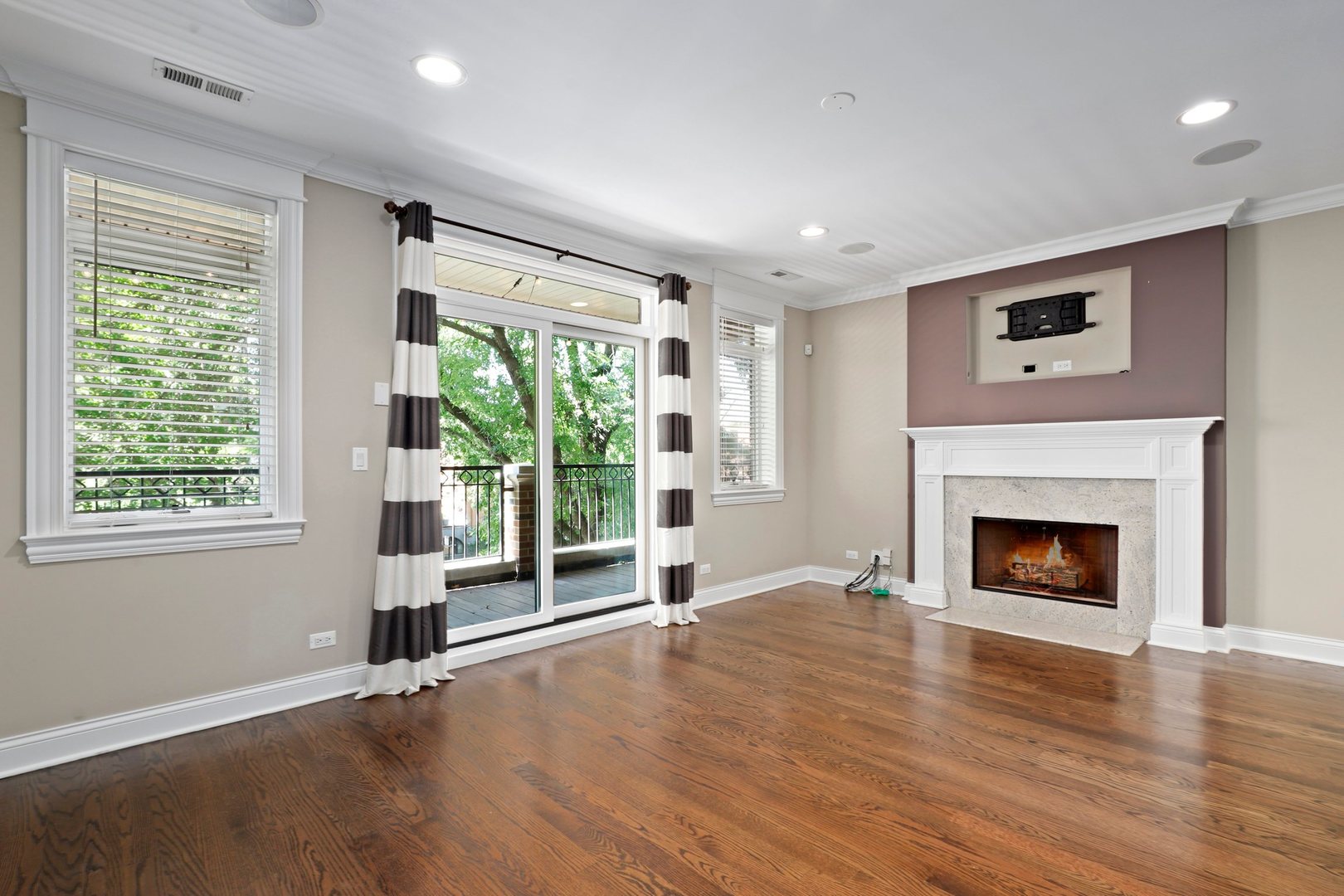 3549 North Reta Avenue, Unit 2 Chicago, IL 60657 - Photo 4 of 30 a view of an empty room with wooden floor and a window