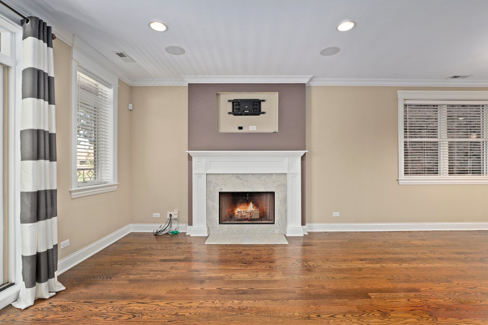 3549 North Reta Avenue, Unit 2 Chicago, IL 60657 - Photo 5 of 30 a living room with a fireplace and windows