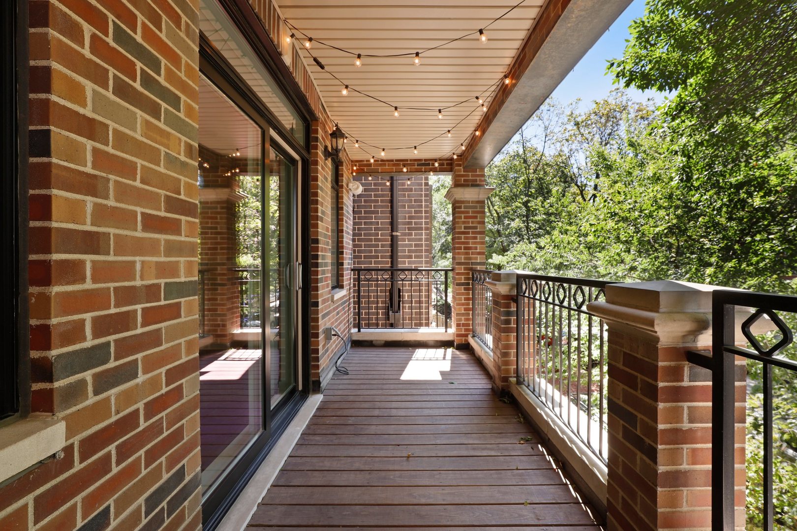 3549 North Reta Avenue, Unit 2 Chicago, IL 60657 - Photo 7 of 30 a view of a balcony with wooden floor
