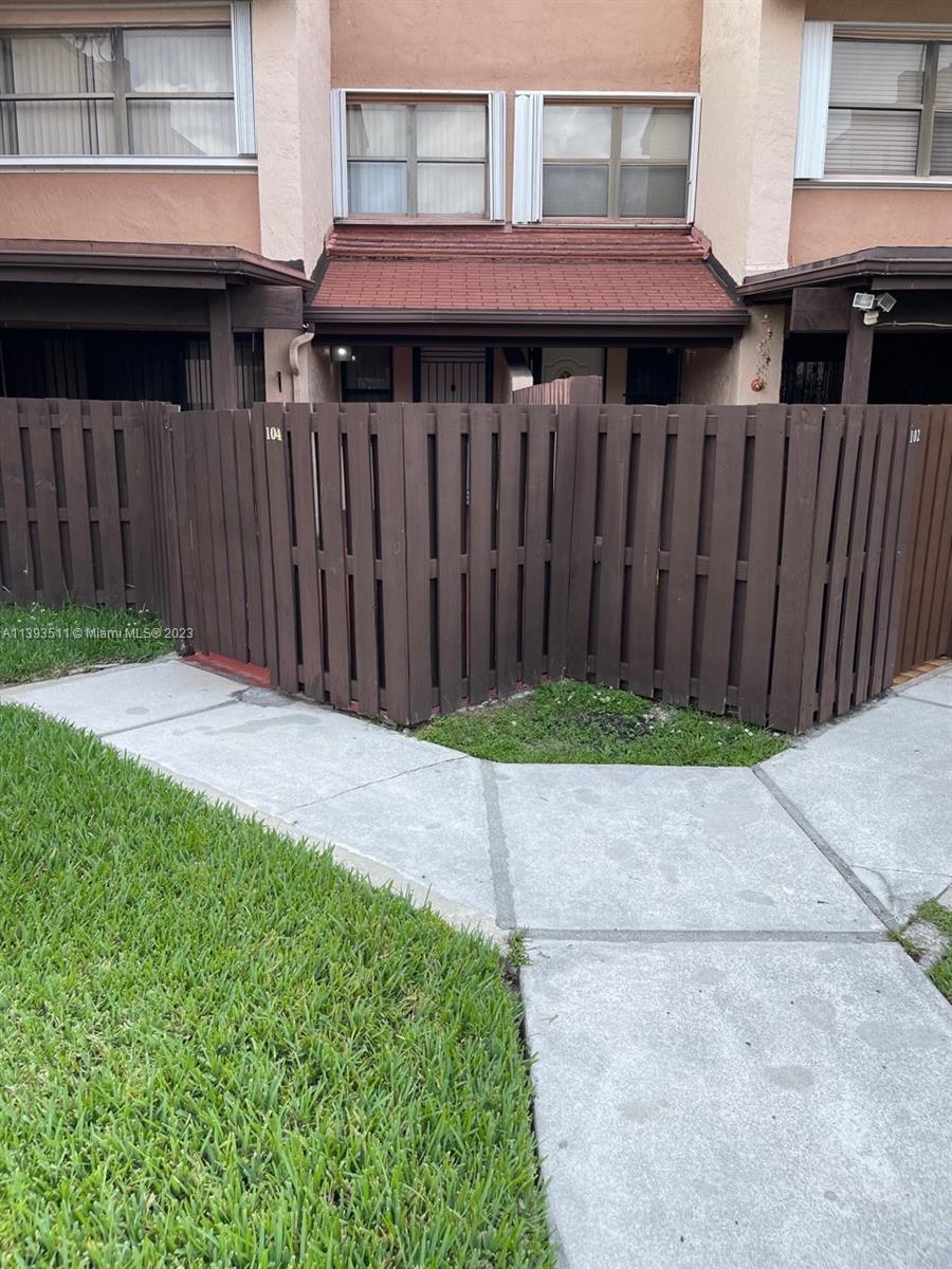 Doral Miami, FL 33172 - Photo 2 of 13 a view of a backyard with wooden fence