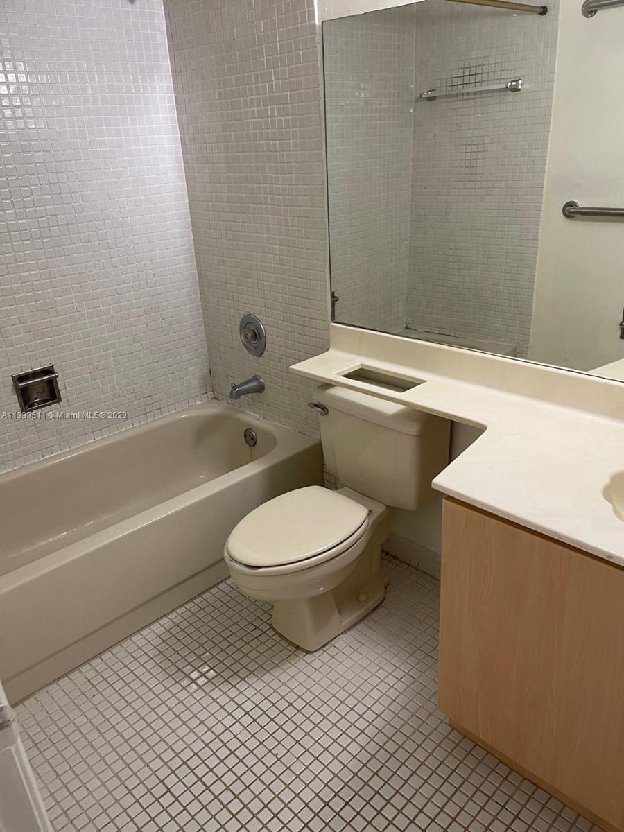 Doral Miami, FL 33172 - Photo 7 of 13 a bathroom with a toilet a sink and bathtub