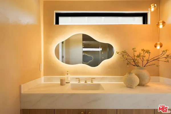 a bathroom with a tub and sink