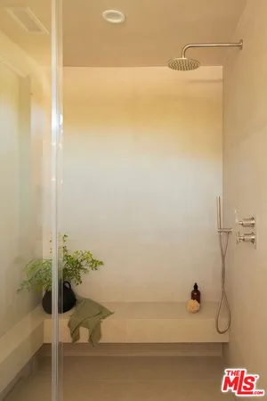 a bedroom with a bed and a table