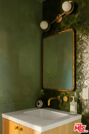 a view of a floor to ceiling window and a tree