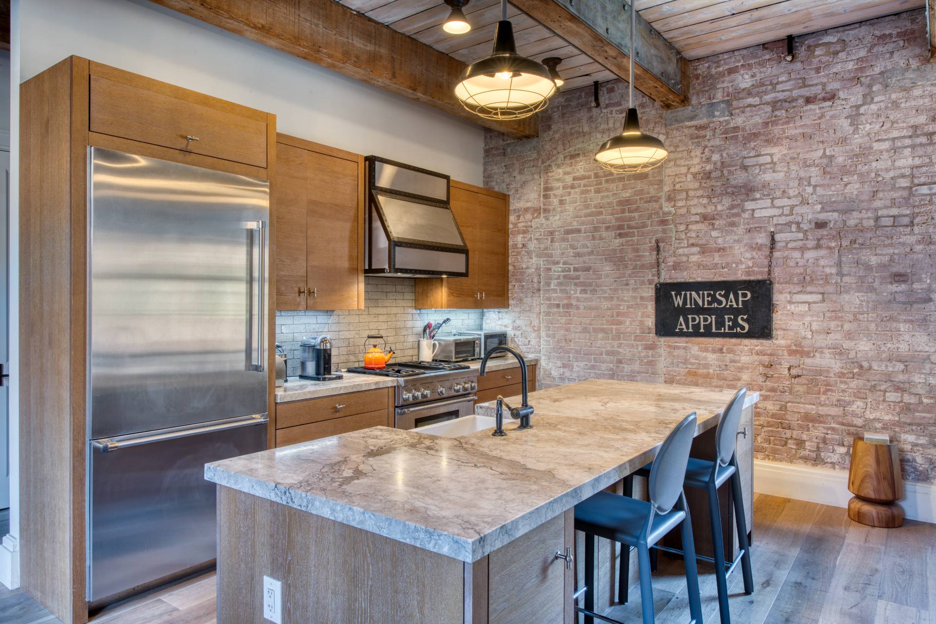 15 Church Street, Unit PH322 Sag Harbor, NY 11963 - Photo 4 of 22 a kitchen with a sink cabinets and stainless steel appliances