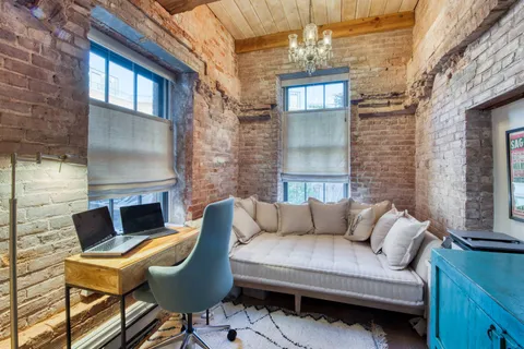 a view of a patio with couches table and chairs