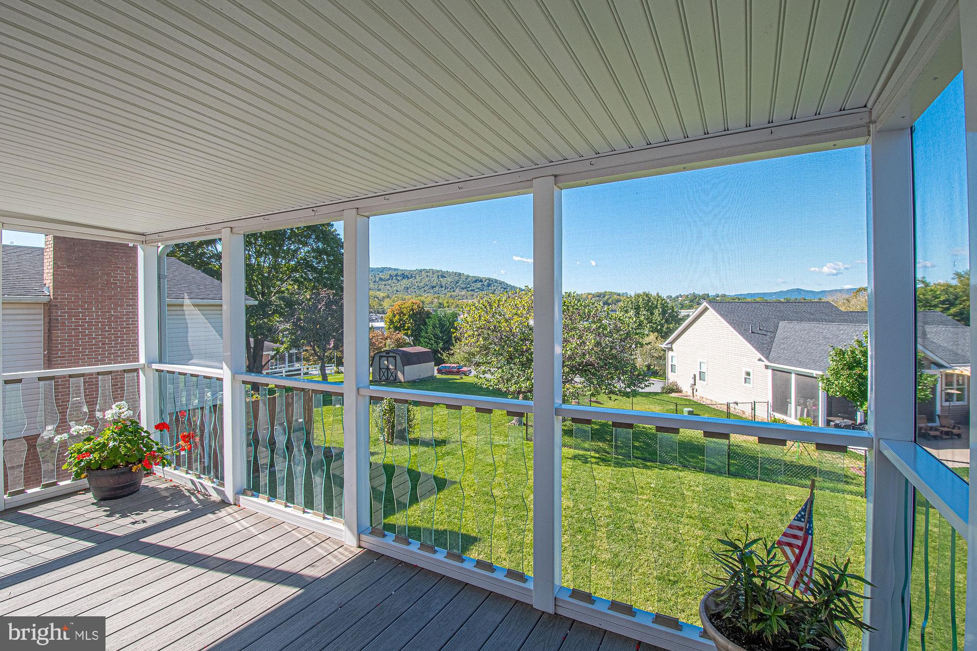 7 Ridge Road Front Royal, VA 22630 - Photo 25 of 48 Screened-in deck with stairs leading to backyard