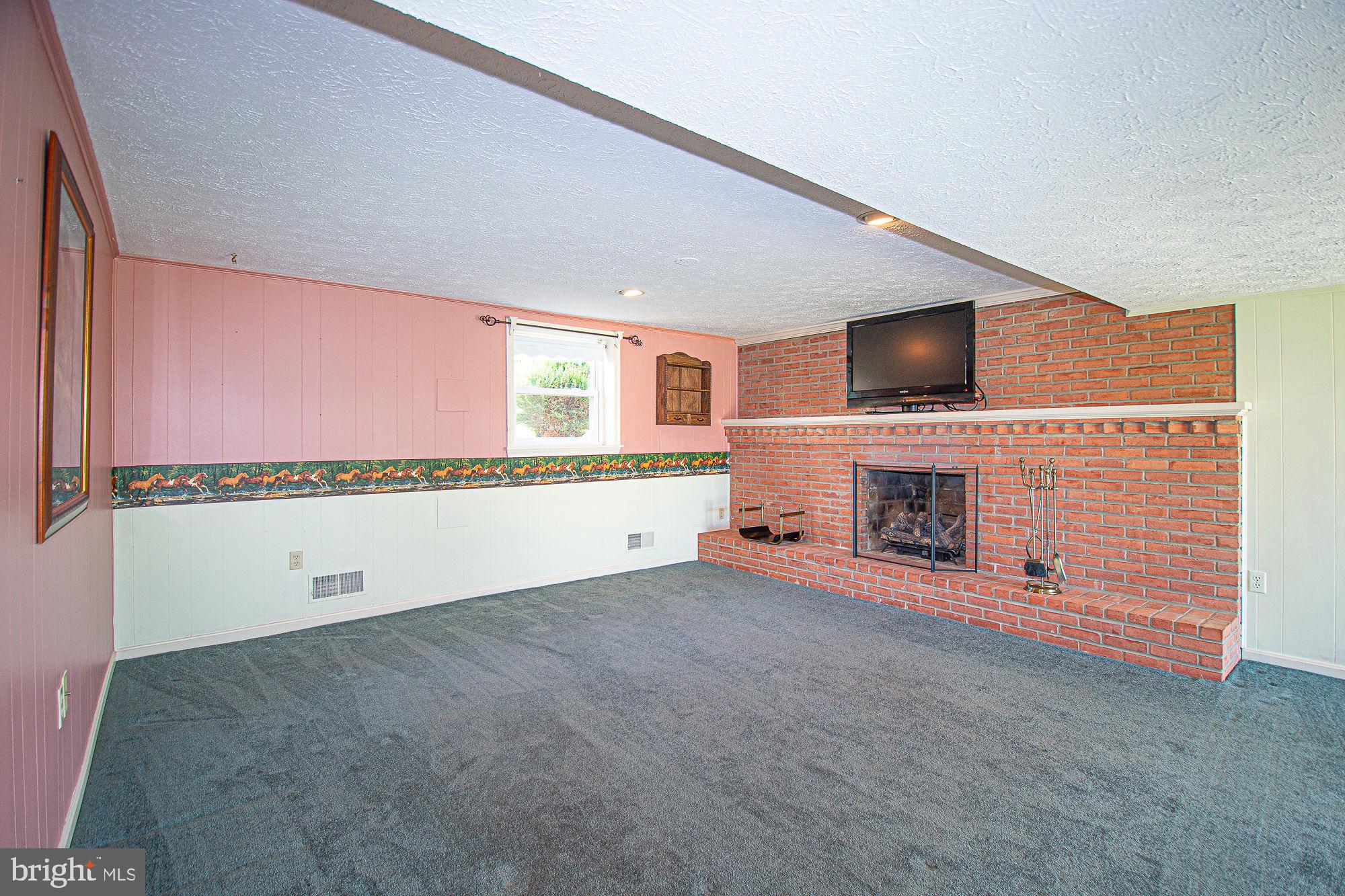 7 Ridge Road Front Royal, VA 22630 - Photo 42 of 48 Brick wall features gas fireplace