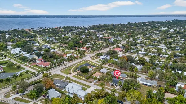 an aerial view of residential houses with outdoor space and street view