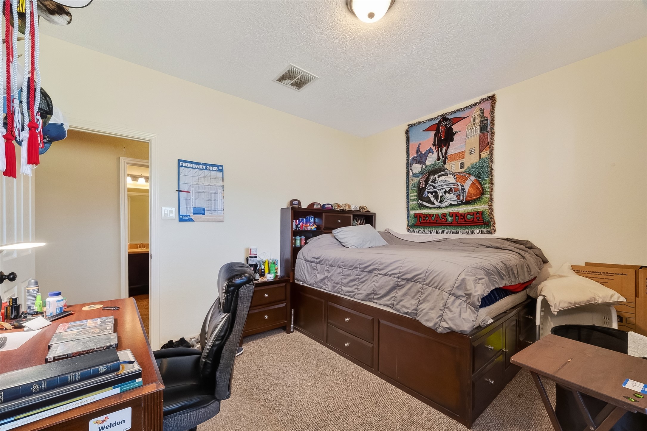 3418 Barbers Hill Road Highlands, TX 77562 - Photo 37 of 50 a bedroom with a bed and dresser
