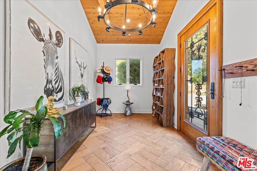 2373 Tuna Canyon Road Topanga, CA 90290 - Photo 14 of 54 a living room with furniture and a potted plant