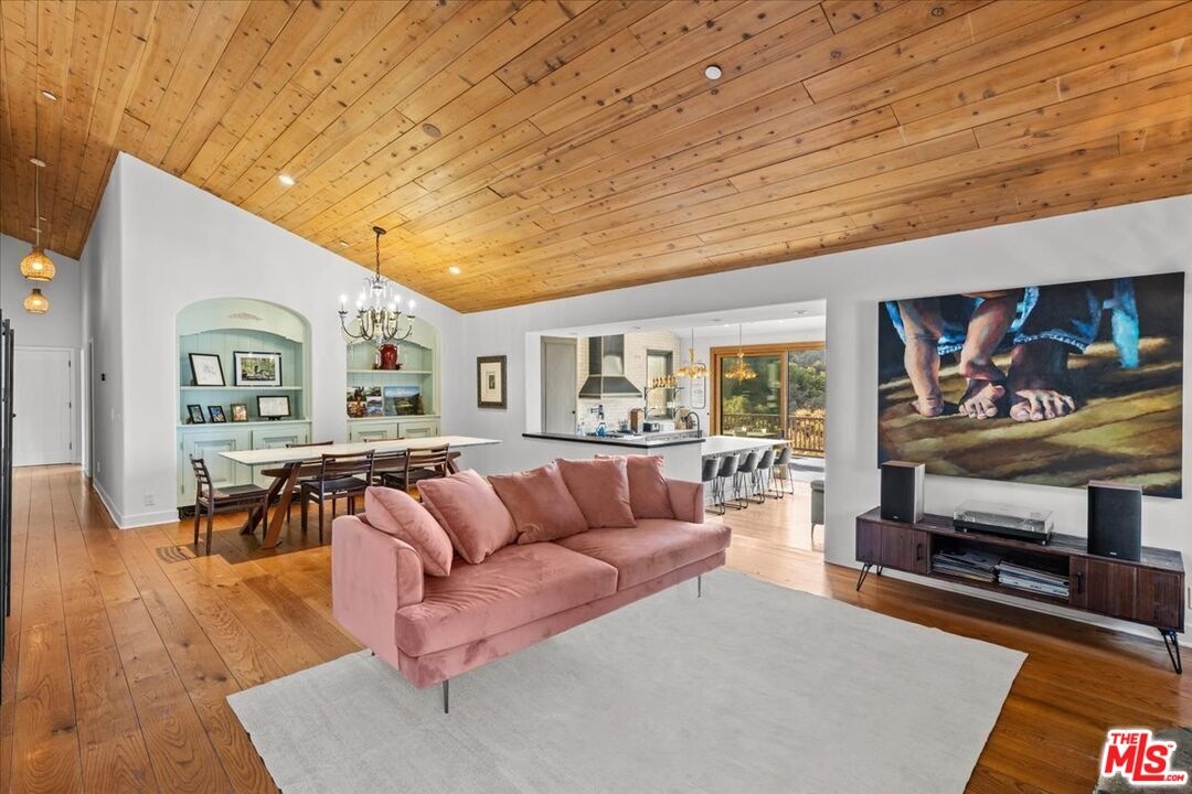2373 Tuna Canyon Road Topanga, CA 90290 - Photo 15 of 54 a living room with furniture and wooden floor