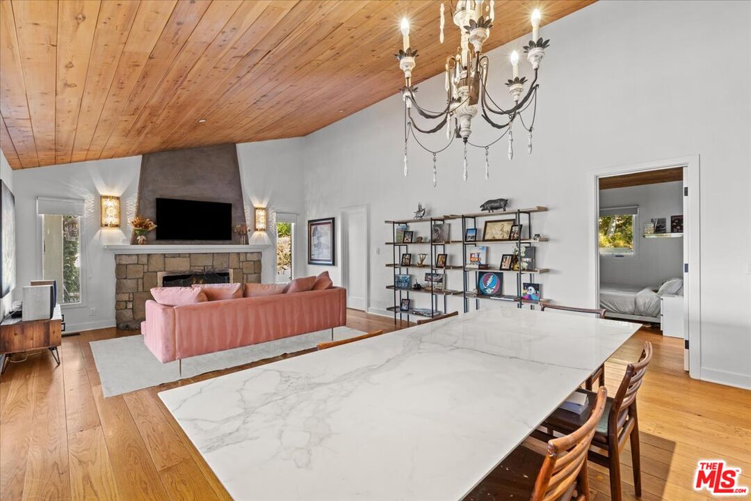 2373 Tuna Canyon Road Topanga, CA 90290 - Photo 16 of 54 a living room with furniture and a flat screen tv