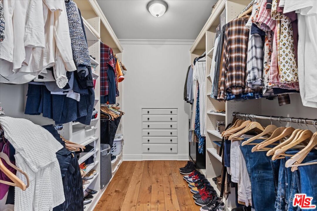 2373 Tuna Canyon Road Topanga, CA 90290 - Photo 23 of 54 a view of walk in closet with clothes and shoes