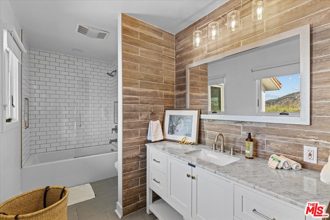 2373 Tuna Canyon Road Topanga, CA 90290 - Photo 29 of 54 a bathroom with a granite countertop sink a toilet and shower