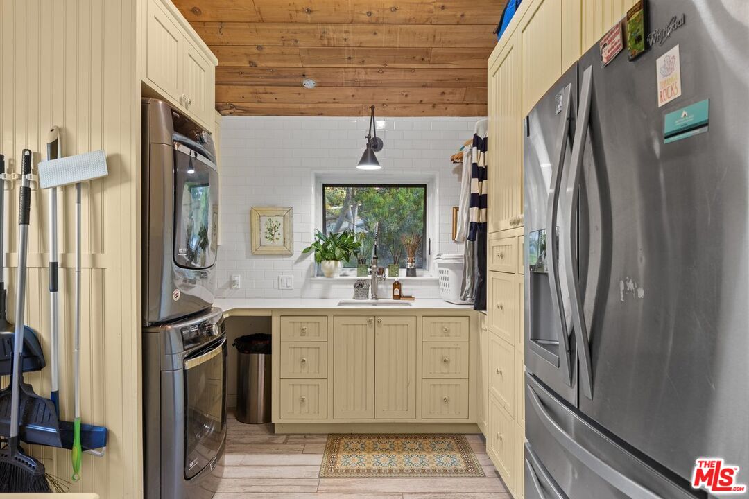 2373 Tuna Canyon Road Topanga, CA 90290 - Photo 37 of 54 a kitchen with stainless steel appliances granite countertop a refrigerator and a sink