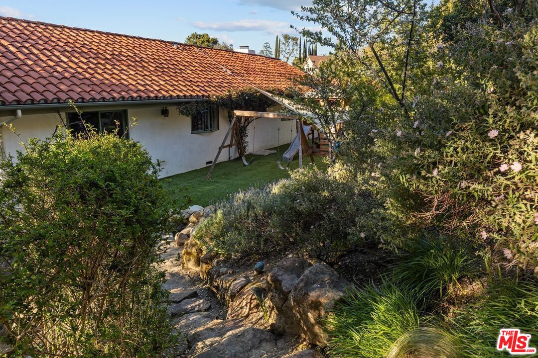 2373 Tuna Canyon Road Topanga, CA 90290 - Photo 42 of 54 a view of a patio with table and chairs and potted plants