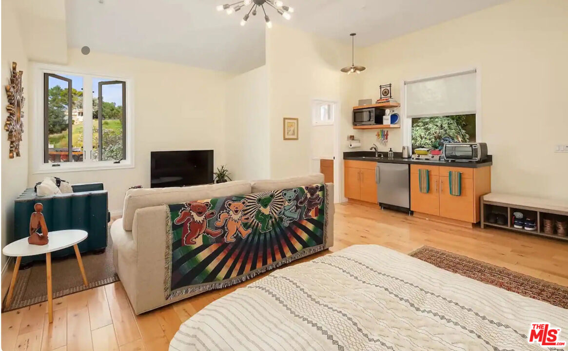 2373 Tuna Canyon Road Topanga, CA 90290 - Photo 49 of 54 a living room with stainless steel appliances kitchen island granite countertop furniture and a kitchen view