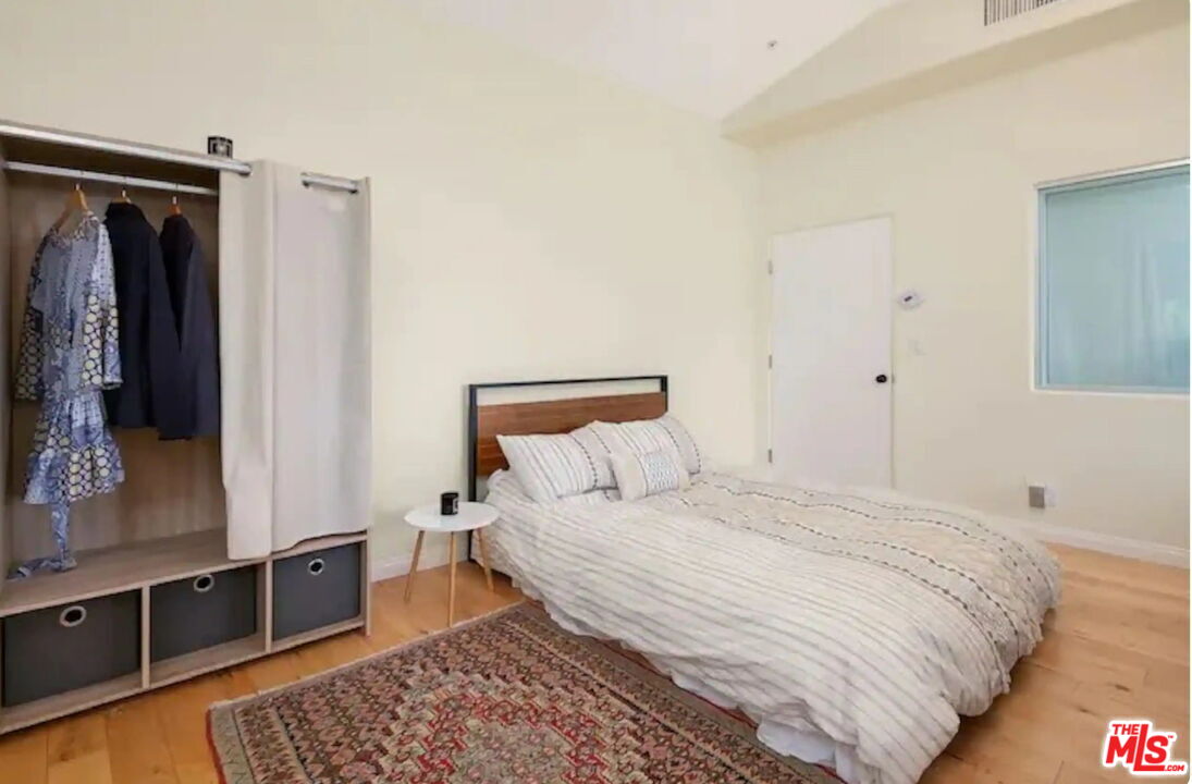 2373 Tuna Canyon Road Topanga, CA 90290 - Photo 52 of 54 a bedroom with a bed and dresser