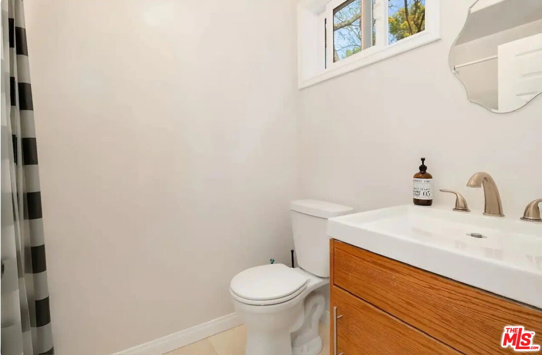 2373 Tuna Canyon Road Topanga, CA 90290 - Photo 54 of 54 a bathroom with a sink a toilet and a mirror