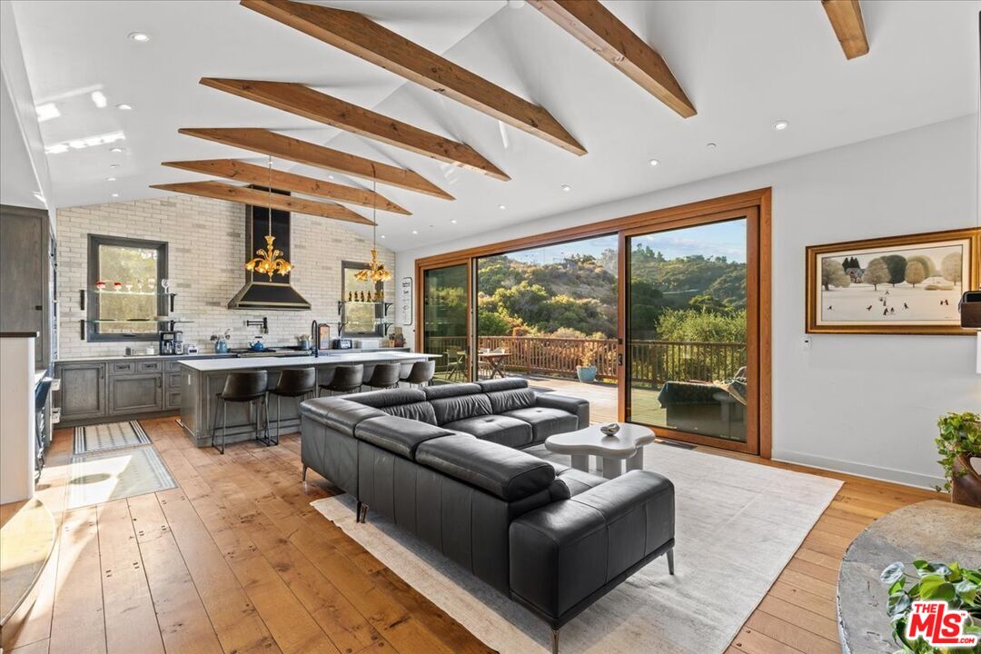 2373 Tuna Canyon Road Topanga, CA 90290 - Photo 7 of 54 a living room with furniture and a large window