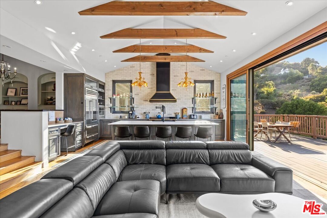 2373 Tuna Canyon Road Topanga, CA 90290 - Photo 9 of 54 a living room with furniture and a large window