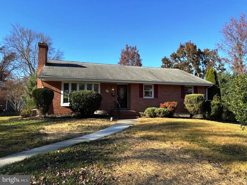a front view of a house with swimming pool and porch with furniture