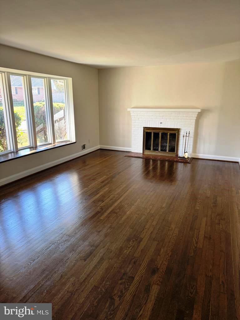 116 Gorsuch Road Lutherville-Timonium, MD 21093 - Photo 12 of 27 a view of a livingroom with wooden floor and window