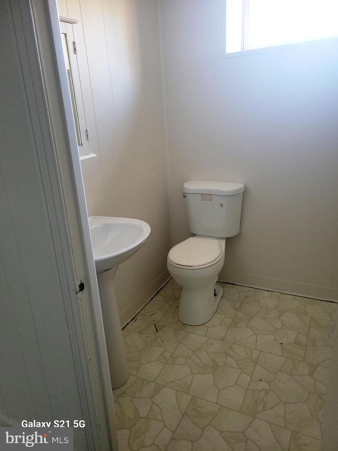 116 Gorsuch Road Lutherville-Timonium, MD 21093 - Photo 23 of 27 a white toilet sitting next to a shower