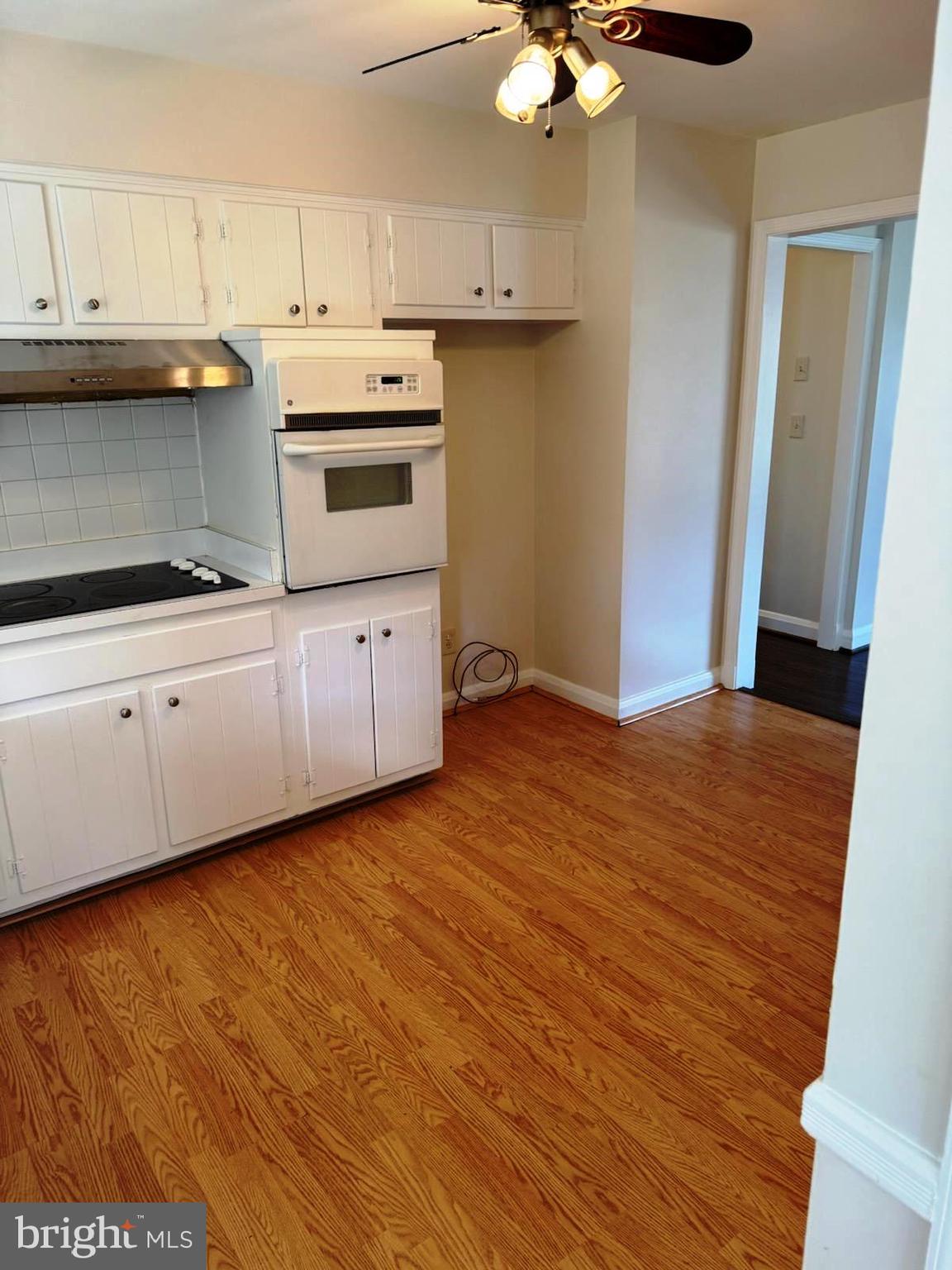 116 Gorsuch Road Lutherville-Timonium, MD 21093 - Photo 9 of 27 a kitchen with granite countertop white cabinets and white appliances