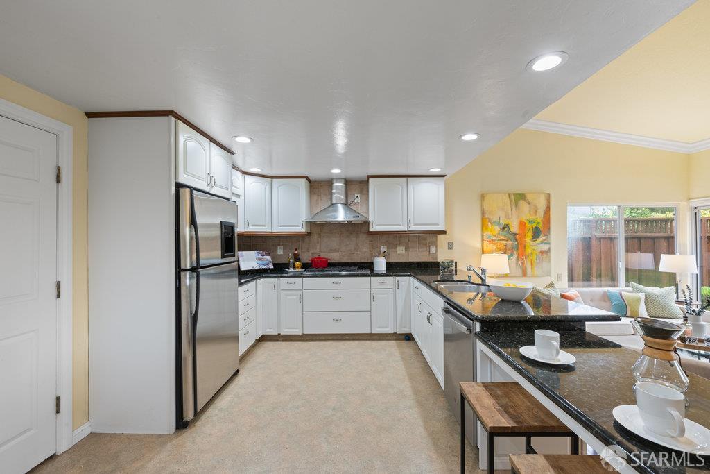 4572 Ross Gate Way Pleasanton, CA 94566 - Photo 16 of 58 a kitchen with sink refrigerator and cabinets