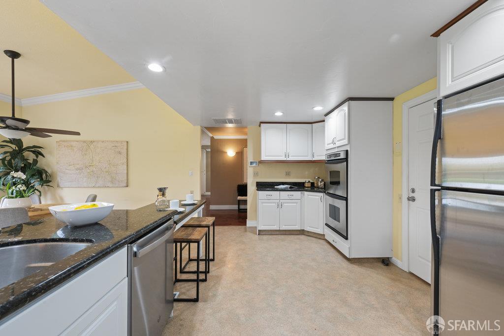 4572 Ross Gate Way Pleasanton, CA 94566 - Photo 20 of 58 a kitchen with a sink appliances and cabinets