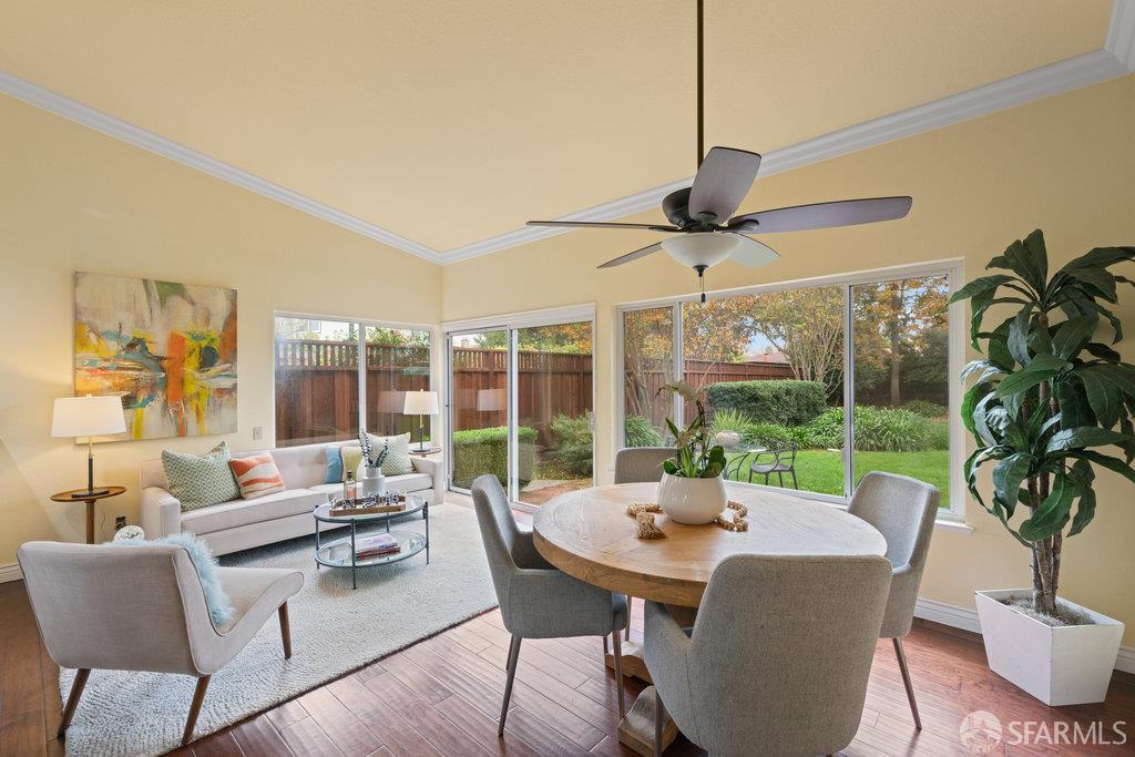 4572 Ross Gate Way Pleasanton, CA 94566 - Photo 22 of 58 a dining room with furniture large windows and a chandelier