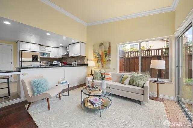 a bedroom with bed couch and window