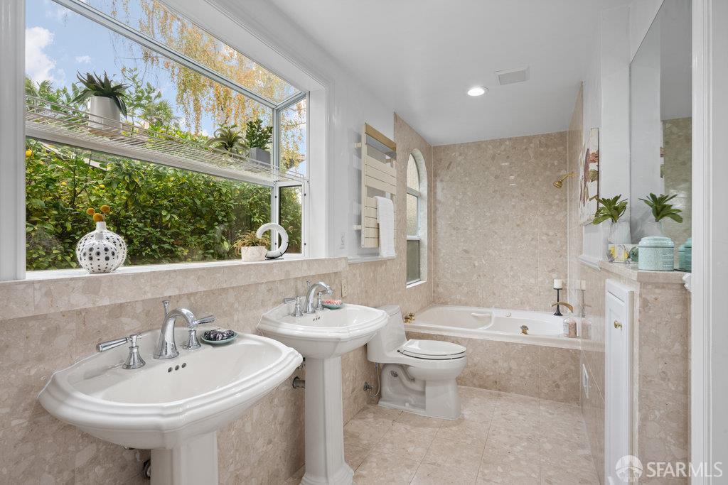 4572 Ross Gate Way Pleasanton, CA 94566 - Photo 32 of 58 a bathroom with a sink and a mirror